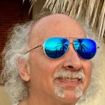 Paul Levine wearing mirrored sunglasses